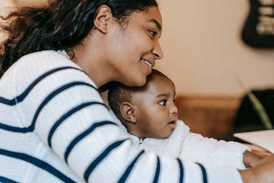 Mother with her child looking at child account