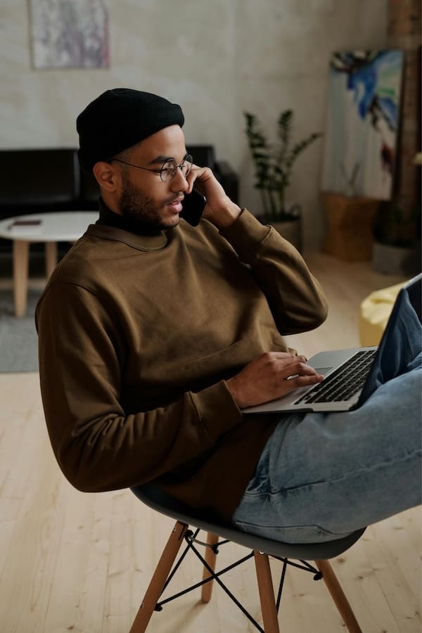 A man on a phone managing his invesmtents